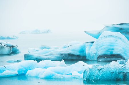 Blue icebergs in Jokulsarlon glacial lagoon, South Icelandの写真素材