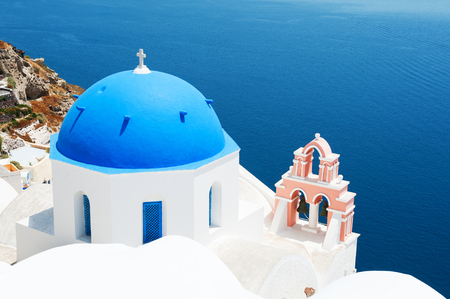 Church with blue domes on Santorini island, Greece. Beautiful landscape, sea viewの写真素材