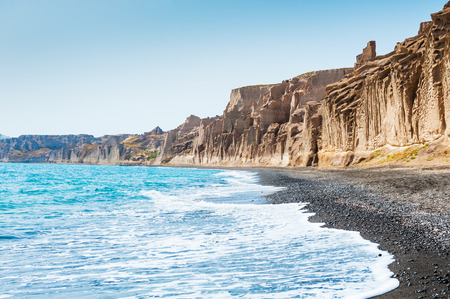 Beautiful beach with volcanic mountains and turquoise water. Vlychada beach, Santorini island, Greeceの写真素材