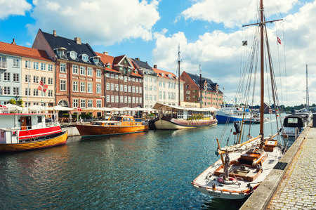 Copenhagen, Denmark - August 18, 2017. Famous Nyhavn pier with colorful buildings and boats in Copenhagen, Denmarkのeditorial素材