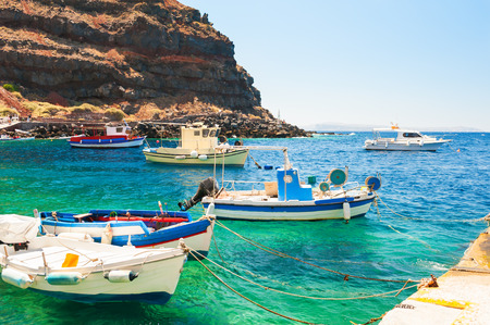 Fishing boat in the port of Santorini island, Greece. Summer landscape, sea viewの写真素材