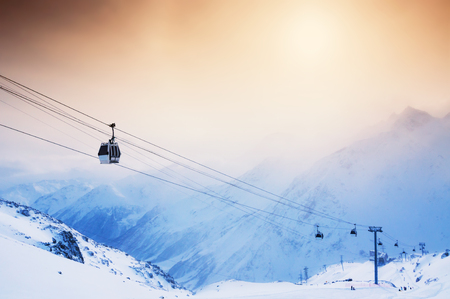 Ski slope and cable car on the ski resort Elbrus. Caucasus, Russian Federation. Winter landscapeの写真素材