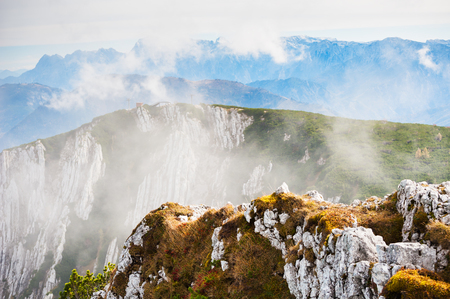 Mountains in foggy morning. Cable car on Feuerkogel ski resort, Austrian Alpsの写真素材