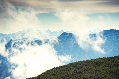 Mountain peaks in foggy morning. Beautiful landscape in Austrian Alpsの写真素材