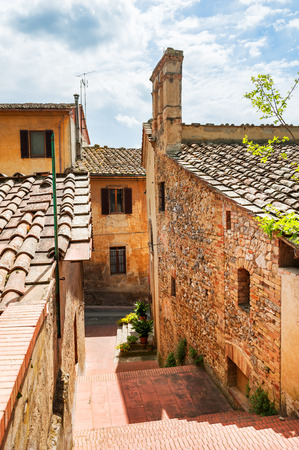 Old street in medieval town San Gimignano, Tuscany, Italyの写真素材
