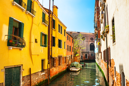 Scenic canal with colorful ancient buildings in Venice, Italy.の写真素材