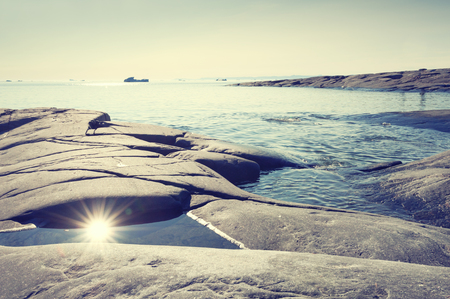 Rocky coast of Atlantic ocean in western Greenlandの写真素材