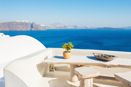 White architecture on Santorini island, Greece. Beautiful terrace with sea view.の写真素材