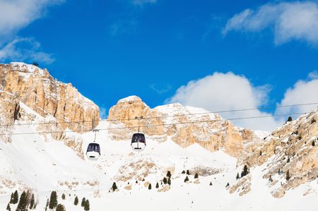 Ski lift in Val di Fassa ski resort in winter Dolomites, Italyの写真素材