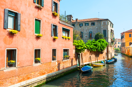 Scenic canal with colorful ancient buildings in Venice, Italy.の写真素材