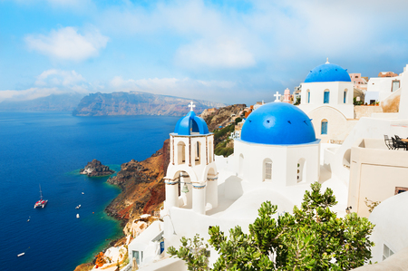 Santorini island, Greece. White church with blue domes against the blue seaの写真素材