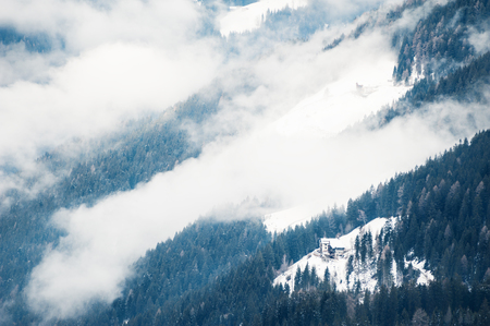 Foggy morning in the winter mountains. Dolomite Alps, Italyの写真素材