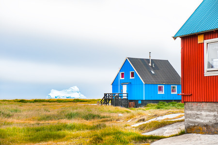 Colorful houses on the coast of Atlantic ocean in Qeqertarsuaq village, western Greenland の写真素材