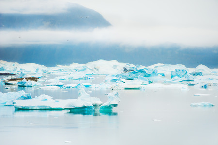 Blue icebergs in Saqqaq village, western Greenlandの写真素材