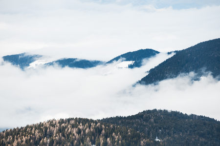 Foggy morning in the winter mountains. Dolomite Alps, Italyの写真素材