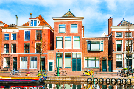 Scenic canal with traditional dutch architecture in Leiden, Netherlandsの写真素材