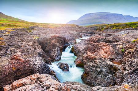 Beautiful waterfall on the Disco island, western Greenlandの写真素材