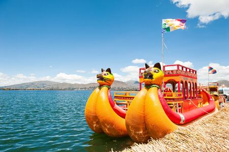 Titicaca lake, Puno, Peru - March, 20, 2017. Traditional Totora boat near Uros floating islands on Titicaca lake in Puno, Peru, South Americaのeditorial素材