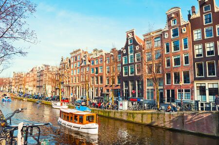 Amsterdam, Netherlands - March, 12, 2017. Scenic canal with traditional dutch architecture in Amsterdam, Netherlandsのeditorial素材