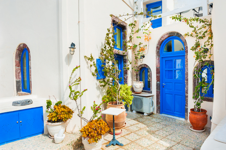 Traditional greek white architecture with blue doors and windows. Santorini island, Greece.の写真素材