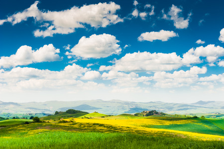 Tuscany landscape, Italy. Green fields and the blue sky. の写真素材