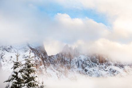 Winter Dolomite Alps in foggy day. Val Di Fassa, Italyの写真素材