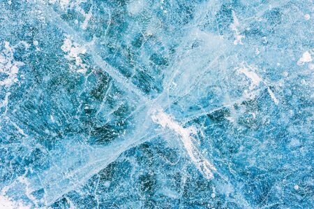 Blue ice on the frozen lake. Beautiful winter backgroundの写真素材