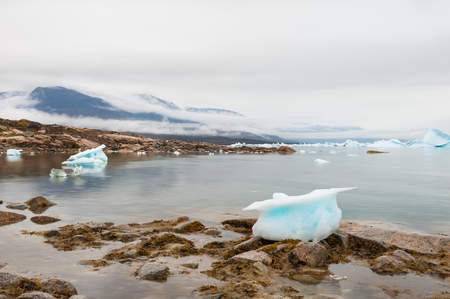 Icebergs on the shore of Atlantic ocean, Saqqaq village, western Greenlandの写真素材
