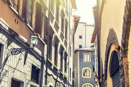 Beautiful street with old buildings in Florence, Italy. Vintage filterの写真素材