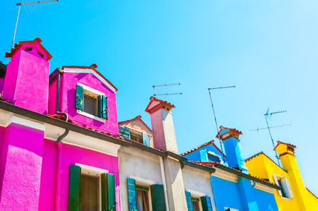 Colorful houses against the blue sky, Burano island, Venice, Italyの写真素材