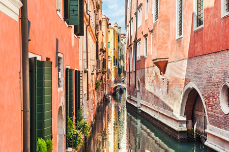Scenic canal with old colorful buildings in Venice, Italy.の写真素材