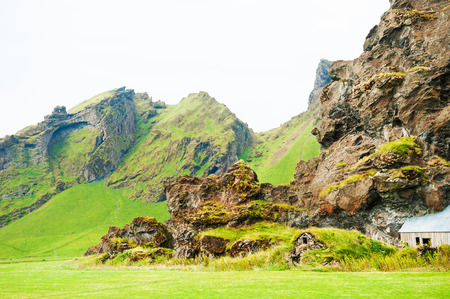 Traditional icelandic houses with grass roof in the mountains. Southern Icelandの写真素材