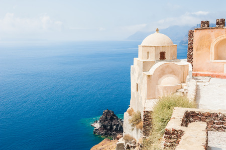 Old church on Santorini island, Greece. Beautiful summer landscape, sea view.の写真素材