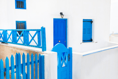 Traditional greek white architecture with blue doors and windows. Santorini island, Greece.の写真素材