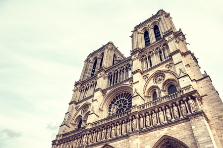 Facade of Notre Dame de Paris Cathedral in Paris, France. Vintage filterの写真素材