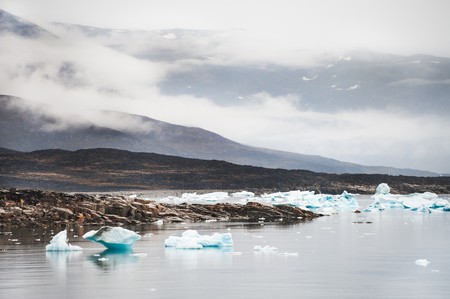 Icebergs on the shore of Atlantic ocean, Saqqaq village, western Greenlandの写真素材