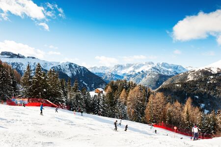 Val Di Fassa ski resort, Canazei, Italy - January, 2, 2018: Skiers skiing down the slope in Val Di Fassa ski resort in winter Dolomite Alpsのeditorial素材