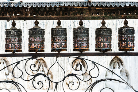 Buddhistic prayer wheels in Swayambhunath Temple in Kathmandu, Nepal.の写真素材