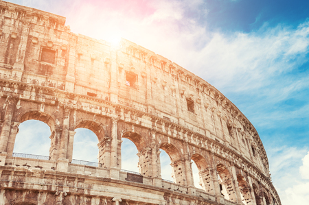 Colosseum against the blue sky in Rome, Italy.の写真素材