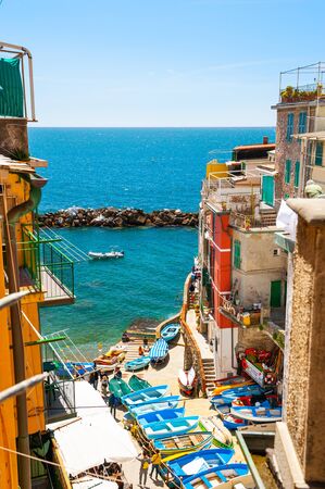 Riomaggiore, Italy - April, 25, 2016: Beautiful sea shore, colorful houses and boats in Riomaggiore, Cinque Terre national park, Italyのeditorial素材