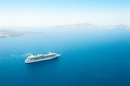 Cruise ship in the sea near the Santorini island, Greece.の写真素材