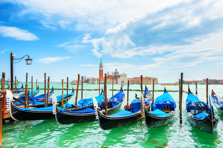 Gondolas on the Grand canal near San Marco square in Venice, Italy. San Giorgio Maggiore Cathedral in the backgroundの写真素材