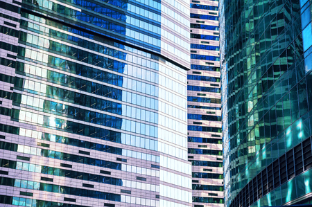 Glass facades of modern skyscrapers close up. Architecture abstract backgroundの写真素材
