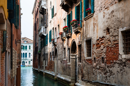 Scenic canal with old architecture in Venice, Italy.の写真素材