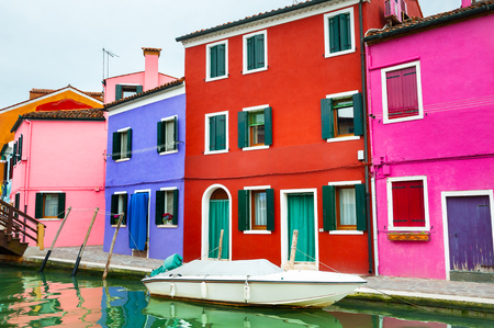 Colorful houses on the canal in Burano island, Venice, Italyの写真素材