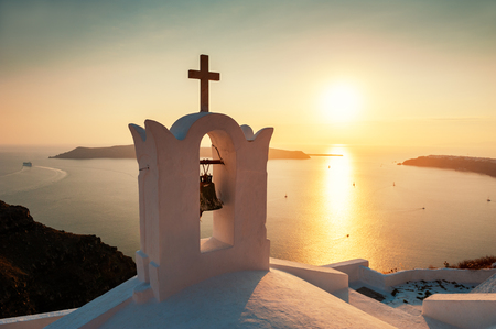 Traditional greek church at sunset on Santorini island, Greeceの写真素材