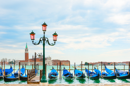 Beautiful promenade of the Grand canal near San Marco square in Venice, Italy. San Giorgio Maggiore Cathedral in the backgroundの写真素材