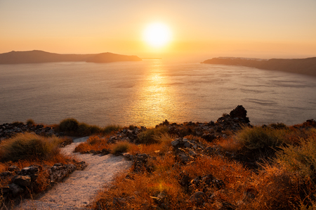 Beautiful sunset on Santorini island, Greece. Pathway to the sea. Beautiful summer landscapeの写真素材
