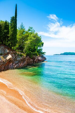 Beautiful beach with turquoise water and cliffs, Adriatic sea, Montenegro. Summer seascape, travel and vacationの写真素材