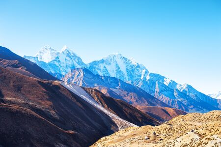 Himalaya mountain range against the sky at sunrise. Khumbu valley, Himalayas, Everest region, Nepalの写真素材
